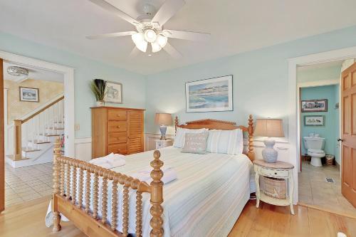 a bedroom with a bed and a ceiling fan at 2714 Bayonne Street in Sullivans Island