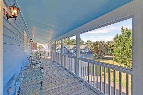 a porch with benches and a view of a house at 2714 Bayonne Street in Sullivans Island