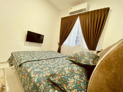 Ένα ή περισσότερα κρεβάτια σε δωμάτιο στο Homestay Ustazah @Adelia