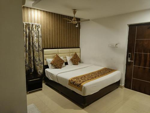 a bedroom with a large bed in a room at The Kings Park Residency in Chennai
