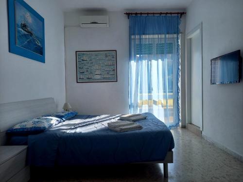 Katil atau katil-katil dalam bilik di A Casa di Lidia B&B Gaeta
