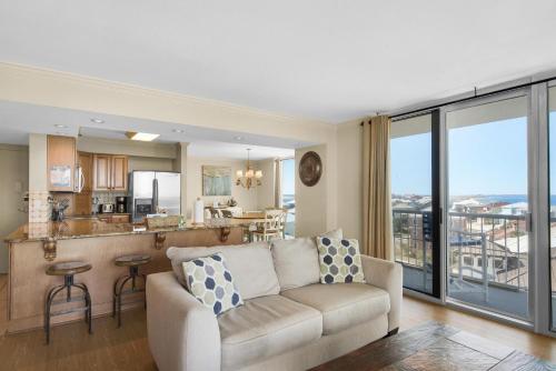 a living room with a couch and a kitchen at Tristan Towers unit 5A in Pensacola Beach