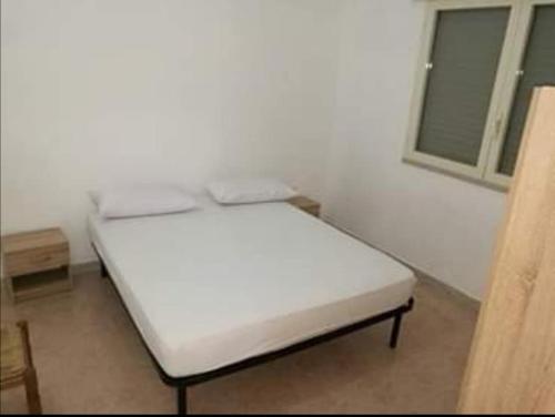 Ein Bett oder Betten in einem Zimmer der Unterkunft Casa alla Marina