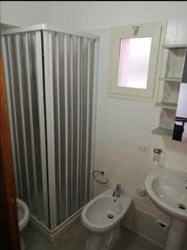 Ein Badezimmer in der Unterkunft Casa alla Marina
