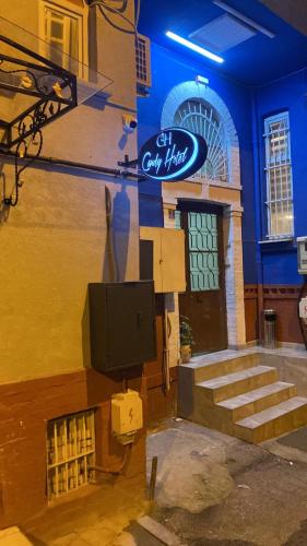 a sign on the side of a building with a tv at Candy Hotel in Istanbul