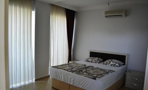 เตียงในห้องที่ Antalya belek Mermaid villas 3 bedrooms close the beach park 1
