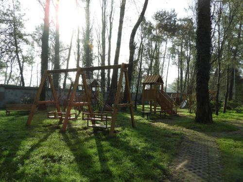a group of playground equipment in a park at Geo Palace Kolkheti National Park in Poti