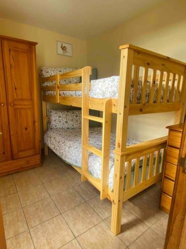 two bunk beds in a room with at Chalet Escapes in Kidwelly