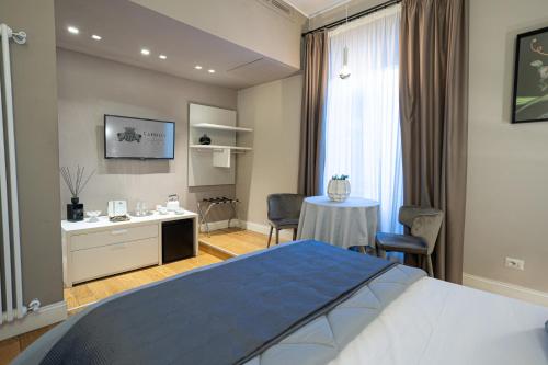 Katil atau katil-katil dalam bilik di Cardilli Luxury Rooms