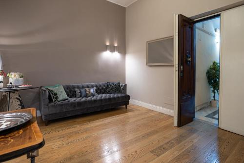 a living room with a couch and a table at Cardilli Luxury Rooms in Rome