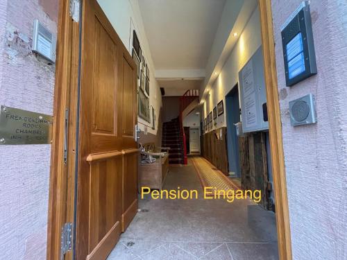 a hallway of a house with a door open at Pension Jeske Heidelberg in Heidelberg