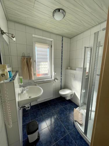 a bathroom with a sink and a toilet at Gästehaus Durst in Rust