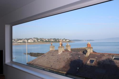 a large window with a view of the ocean at SEACLIFF ROAD APARTMENT in Bangor