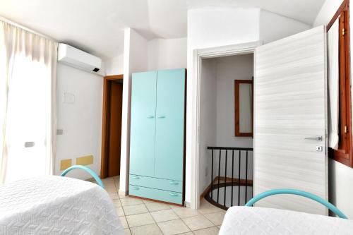 Katil atau katil-katil dalam bilik di Residence Chiaro di Luna