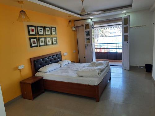 a bedroom with a large bed in a room at Hotel Sai Advika in Mapusa