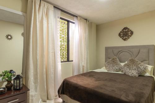Ein Bett oder Betten in einem Zimmer der Unterkunft Edificio Familia Gómez 2