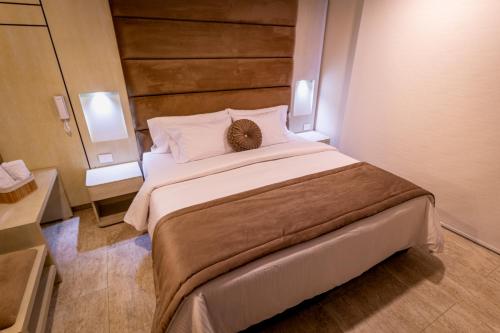a bedroom with a large bed in a room at Trugo Luxury Rooms in Armenia