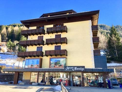 a large building with balconies on the side of it at EMARGHE, CASA A MOENA in Moena