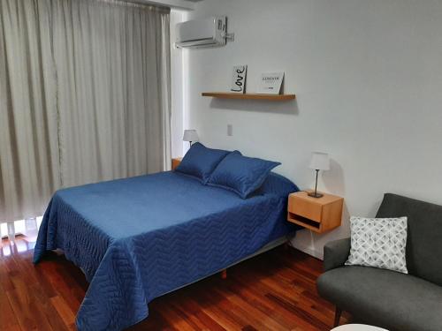 Ένα ή περισσότερα κρεβάτια σε δωμάτιο στο Balcarce Río.