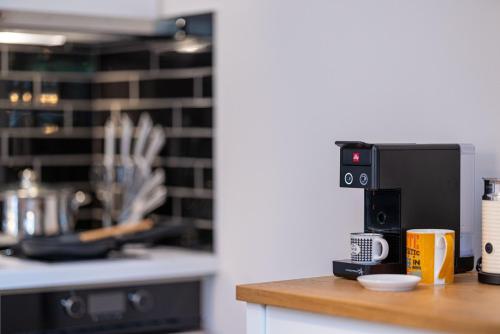 a kitchen with a counter top with a coffee maker at Desa Green Homes in Ancient Epidavros