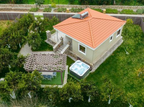 an overhead view of a house with an orange roof at Desa Green Homes in Ancient Epidavros