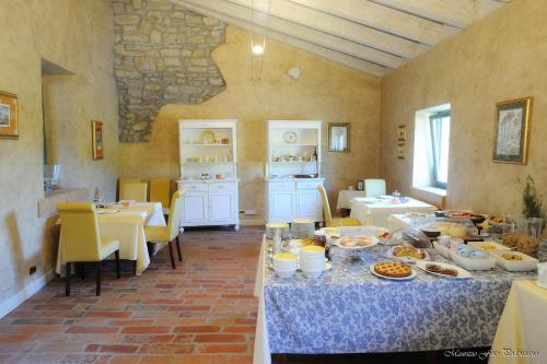 a room with two tables with food on it at Relais La Colombara Spa & Wellness in Travo
