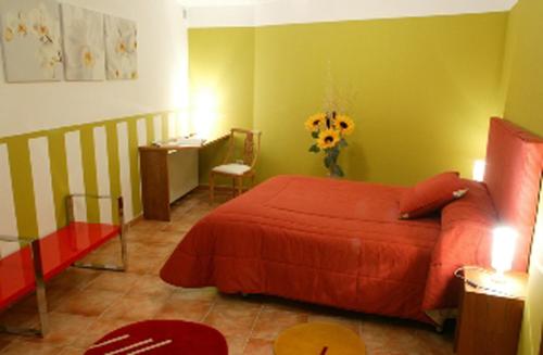 a bedroom with a bed and a table and a desk at Villa Don Juan II in Segovia