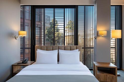 Postel nebo postele na pokoji v ubytování Barnovi Boutique Hotel