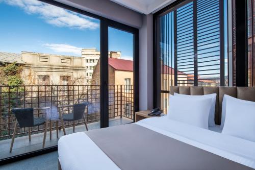 Postel nebo postele na pokoji v ubytování Barnovi Boutique Hotel