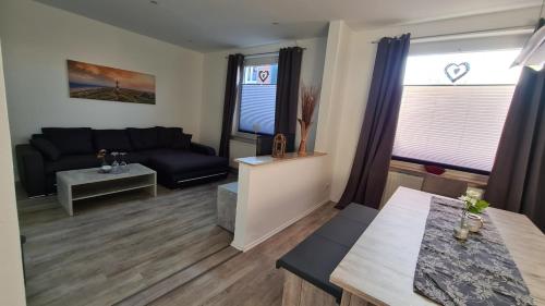 Ένα ή περισσότερα κρεβάτια σε δωμάτιο στο Ferienhaus Femke