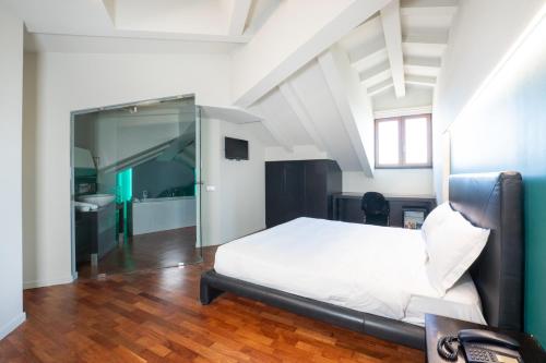 Postel nebo postele na pokoji v ubytování SIRIOHotel