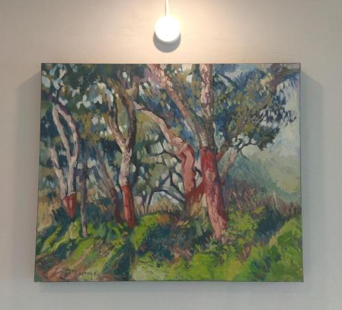 a painting of trees hanging on a wall at Casa Fisher in Vendas Novas