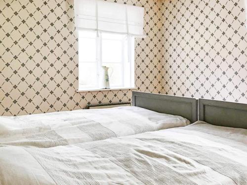 Postel nebo postele na pokoji v ubytování Holiday home ÅSBRO III