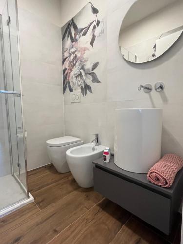 a bathroom with a sink and a toilet and a shower at CASA AL VENTO in Cerreto Guidi
