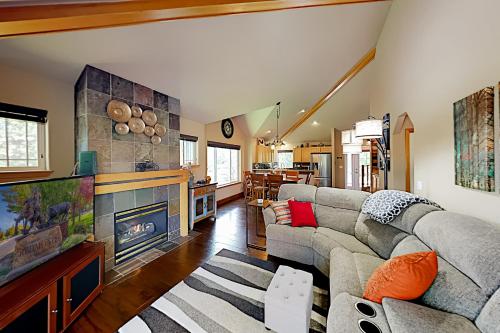 a living room with a couch and a fireplace at Eagle Crest in Redmond