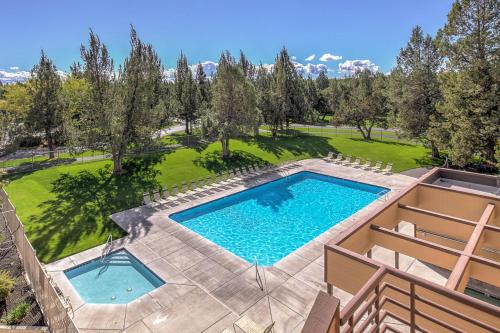 an overhead view of a swimming pool with a lawn and trees at Eagle Crest in Redmond