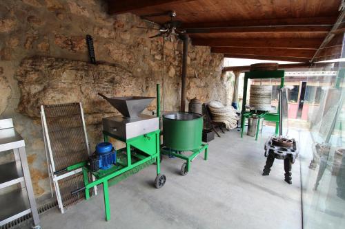 a room with a stove and other items in it at Finca Heredad La Boquilla in Enguera