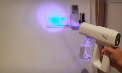 a person holding a wii remote in a room at Sunway Paradise Home Staycation PH2120 SELF CHECK IN OUT in Subang Jaya