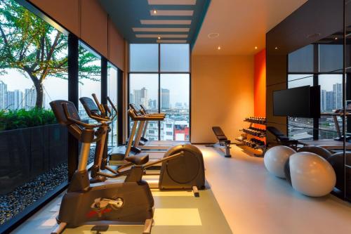 a gym with cardio equipment in a building at ibis Styles Bangkok Sukhumvit Phra Khanong in Bangkok