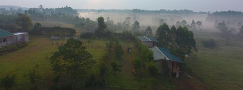 an aerial view of a house in a field at Muga Eco Village in Ntungamo