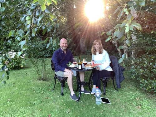 a man and a woman sitting at a table at Kilmahon House, P25A973 in Shanagarry