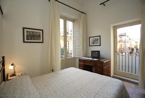 Кровать или кровати в номере Apartment Central 4 Taormina