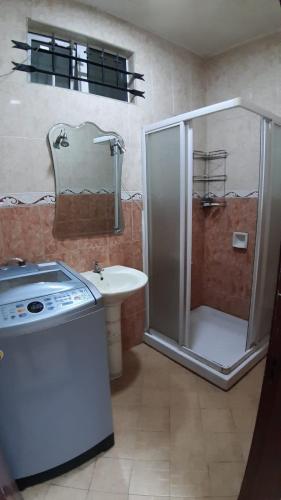 a bathroom with a shower and a sink at RS VILLA student share apartments with private room,free wifi ,100mts to the beach in Flic-en-Flac