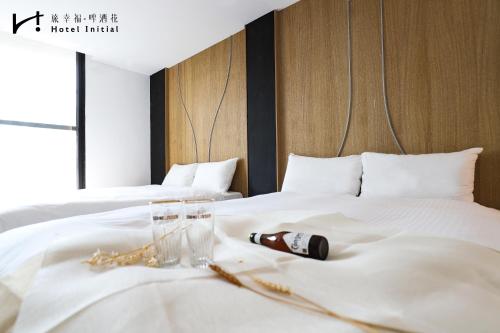 Postel nebo postele na pokoji v ubytování Hotel Initial-Beer