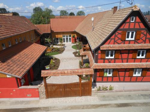 an overhead view of a house with red roofs at Les Authentics - Le Domaine d'Autrefois & Spa in Bolsenheim