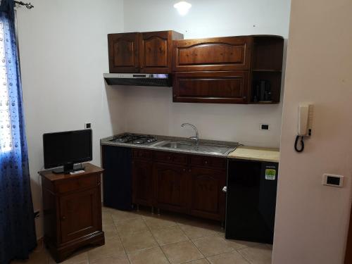 Η κουζίνα ή μικρή κουζίνα στο Casa vacanze Rose E Fiori Sardegna