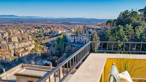 a view of a city from the balcony of a house at Casa Checca e Casa Maria appartamenti per vacanze in Caprarola
