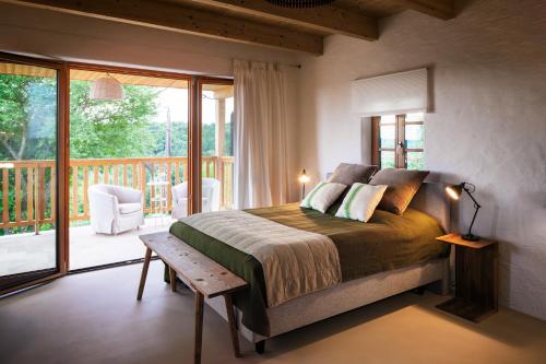A bed or beds in a room at Ferienhaus mit privaten Schwimmteich und Sauna