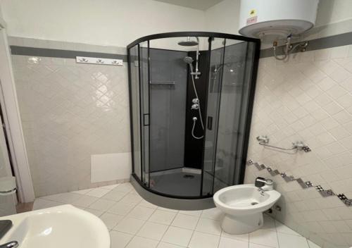 a bathroom with a shower and a toilet and a sink at CELESTE Central Apartment in Porto Rotondo with private parking in Porto Rotondo