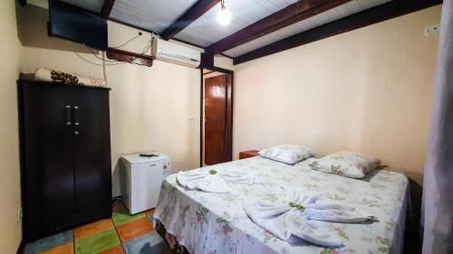 מיטה או מיטות בחדר ב-Pousada do Alemão